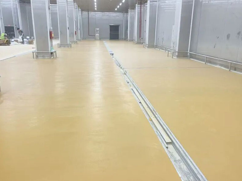 Close-up view of polyurethane mortar flooring surface showing seamless finish and anti-slip texture, ideal for food processing areas with wet conditions