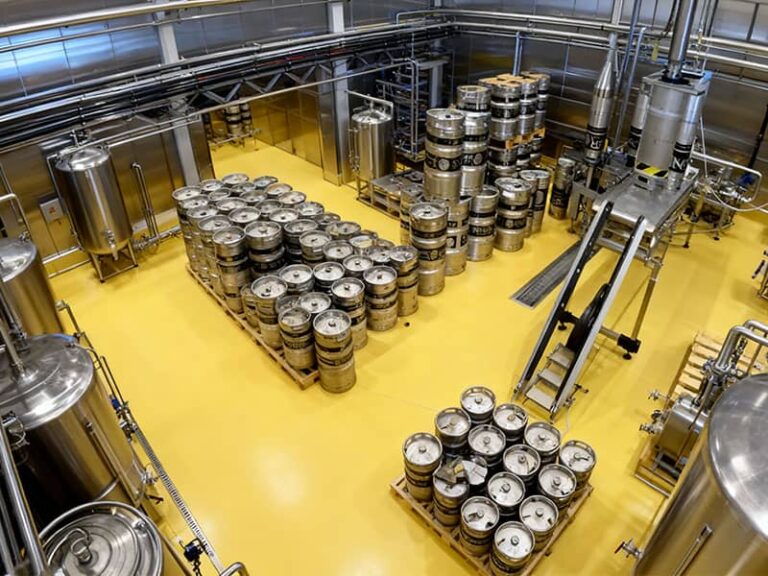 A completed seamless urethane brewery floor in a fermentation cellar, showing excellent chemical resistance and easy-clean surface with proper drainage.