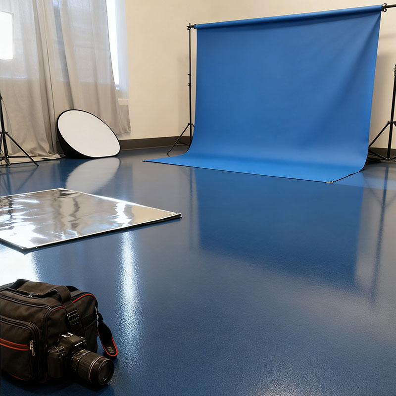 Elegant FortiFlex Q decorative quartz flooring in a professional photography studio, featuring a seamless, UV-stable surface that provides a consistent, non-reflective backdrop.