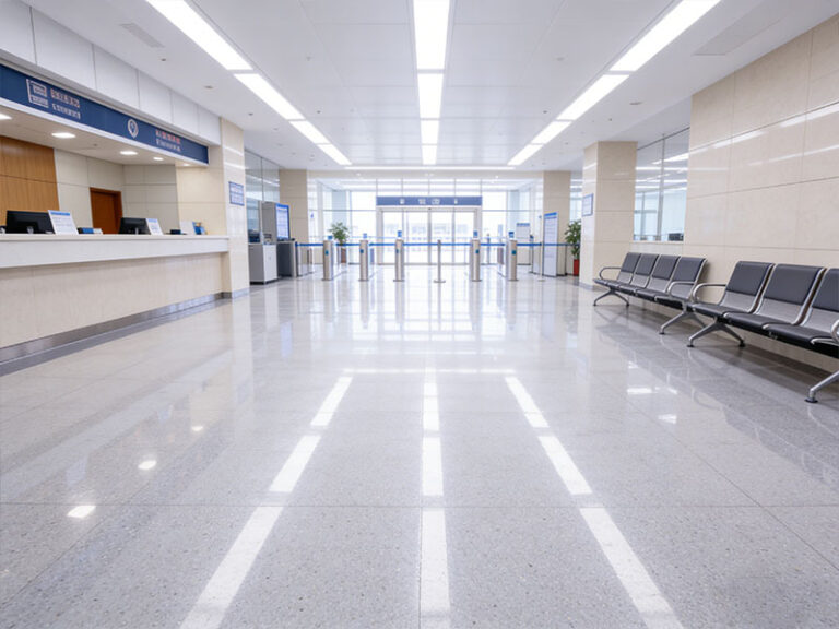 Seamless TerraFlex AC urethane flooring in a municipal government facility: durable, high-gloss cementitious floor with service counter, seating, and access control setup.