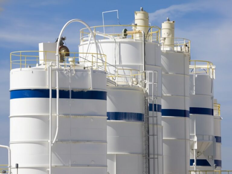 fluorocarbon paint industrial storage tanks white blue stripes