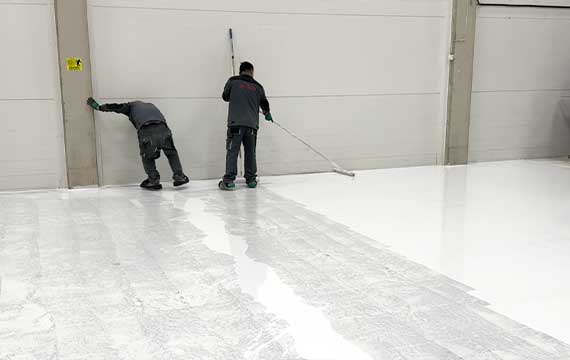 Applying a high-performance water-based polyurethane topcoat to provide wear resistance and UV stability for an industrial facility in Sweden.